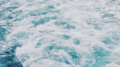 Serene Trails in Water From a Large Vessel Wake
