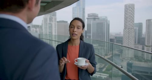 Business People at Conference Meeting and Talking on Office Rooftop