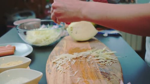 Transferring Chopped Cabbage to a Plate