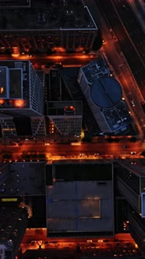 Aerial view of Chicago's illuminated streets and buildings at night