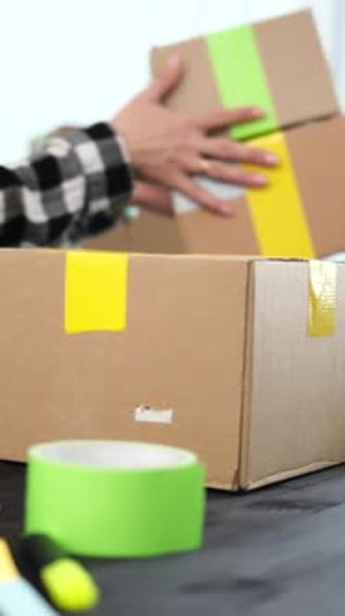 Girl Packing Packing A Cardboard Box For Shipping