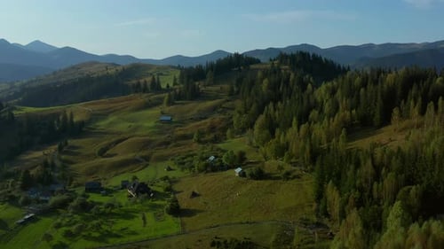 Drone Lonely Mountain Buildings View Green Natural Fields Against Blue Sky. Stunning