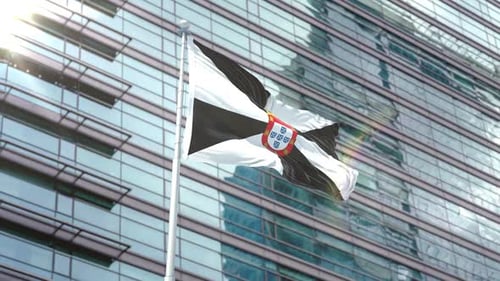 Ceuta Flag Waving in Front of Modern Corporate Building