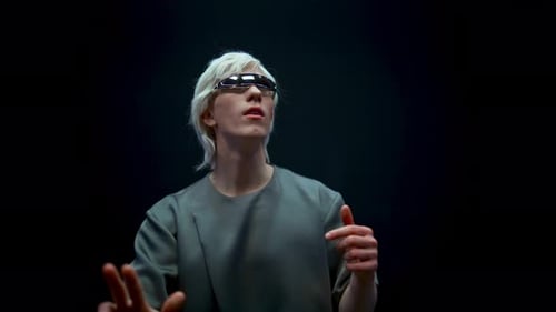 Man with Futuristic Glasses Touching Invisible Screen