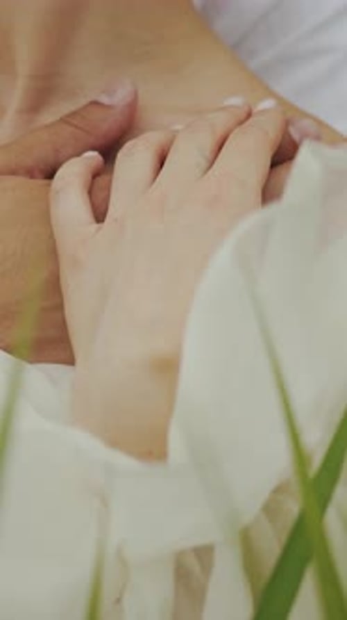 Close Up of a Romantic Couple Holding Hands