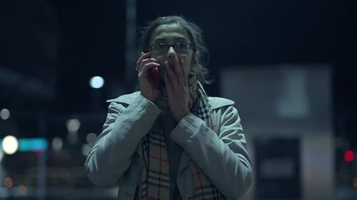 Nighttime Communication Captured Emotions Beneath the Illuminated City Lights and Glow