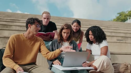Students Study Together Outdoors on Campus Steps