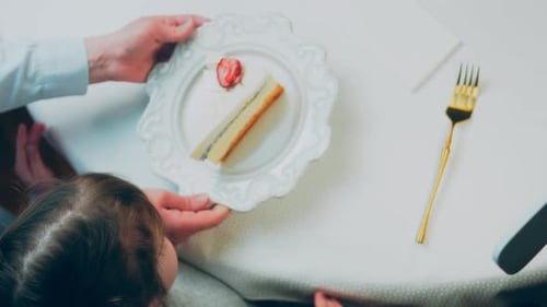 Little Girl Waiting for Birthday Cake Slice