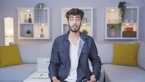Young Adult Man Talking on Camera Indoors