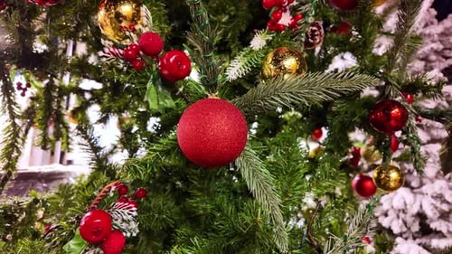 Close-up of Red Christmas Ornament on Decorated Tree