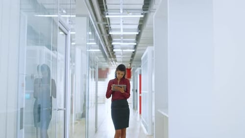 Portrait of Black Business Woman Working on Tablet Computer in Modern Office