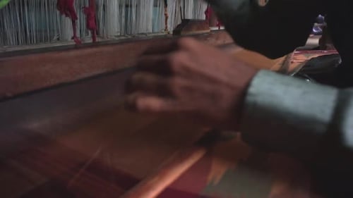 Old style of weaving in a textile factory indoors