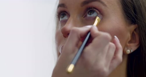 Eye Contouring Makeup Preparation of a Young Beautiful Woman for Party