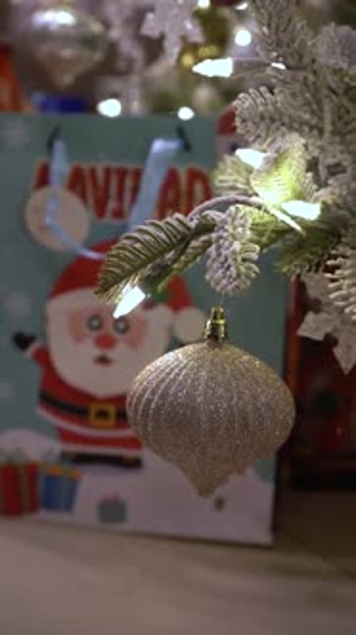 Christmas tree branch ornament with christmas gift bag