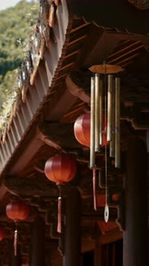 Red Lanterns and Wind Chime Under Temple Roof