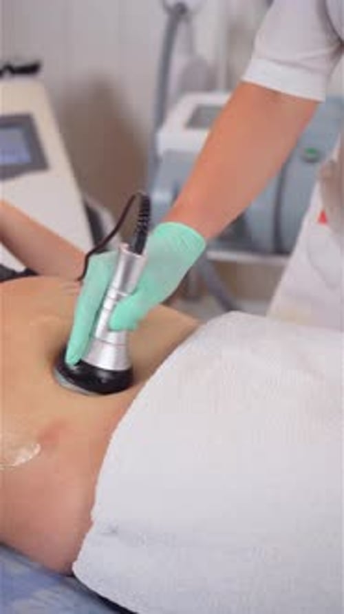 Medical Procedure on Woman's Torso in Hospital