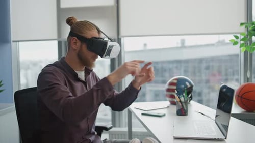 Man Using Virtual Reality Headset in Office