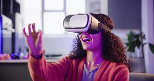 Excited Young Woman Using Virtual Reality Headset