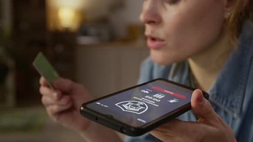 Woman Revealing Credit Card Details to Fraudsters on Phone