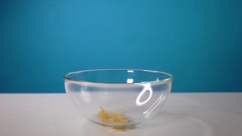 Slow Motion of Falling Corn Flakes on Bowl