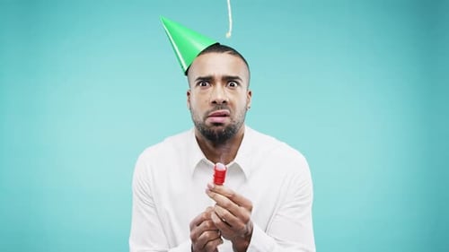 Man, party and popper with birthday surprised, shocked or disappointed upset face with green party