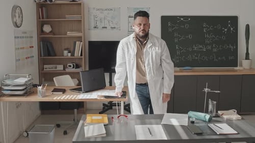 Science Teacher Stands in Classroom Ready to Teach