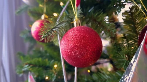 Festive Christmas Tree With Red Ornaments Close Up