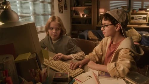 Boys Collaborate Using Old Computer, Celebrating Success