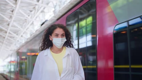 Young Adult Using Smartphone at Train Station