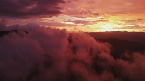 Fiery Sunrise Over Mountainous Cloudscape Aerial