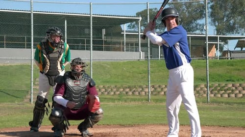 Adult Men Practicing Baseball on a Sunny Day