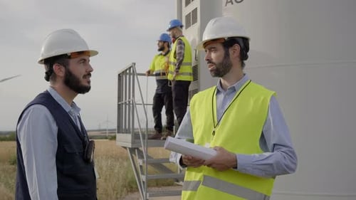 Group of Engineers in Wind Power Station