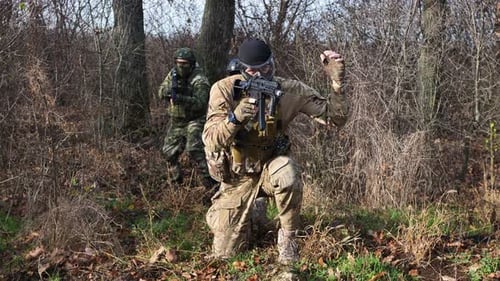 A Group of Soldiers in a War Zone Playing Airsoft