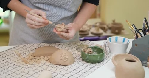 Woman Forming Clay Pot Shape By Hands Closeup in Artistic Studio