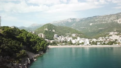drone approaching scenic coastline in Adriatic Sea near Bečići town in the municipality of Budva, Mo