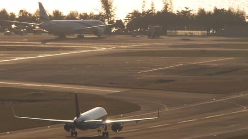 Airplane Takes Off at Sunrise Near Ocean