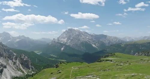 Aerial of mountains and forested valleys in the Dolomites, Italy