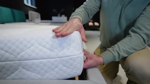 Customer Buying New Bed and Mattress at Homeware Supermarket