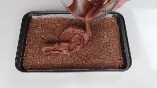 Spreading icing on a slice