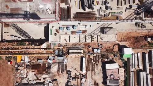 Aerial view of a construction site with cranes operating