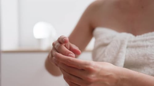 Cosmetic Product, Woman Slowly Doing Skin Massage In Spa Salon Camera in Motion