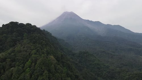 Aerial view of Merapi Mountain in indonesia with tropical forest around it
