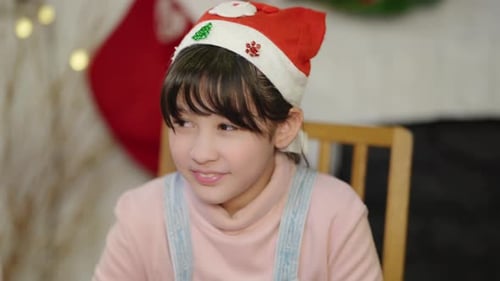 Child Wearing Santa Hat During Christmas Celebration