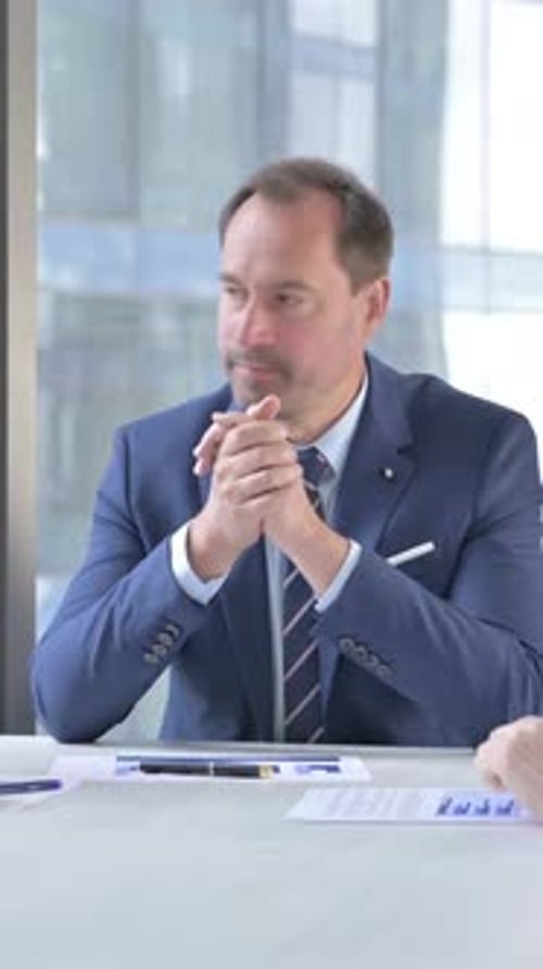 Professional Man Talking in Business Meeting at Office