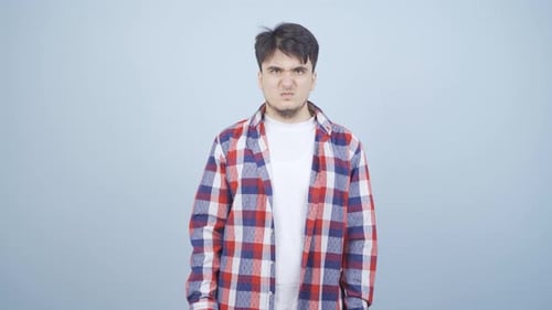 Man getting angry at camera.