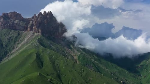 Scenic Aerial View of Green Mountains and Clouds
