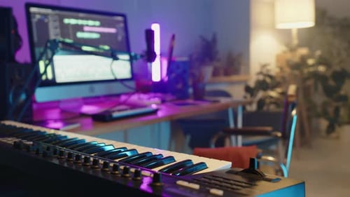 Close Up of Synthesizer in Neon-Lighted Home Music Studio