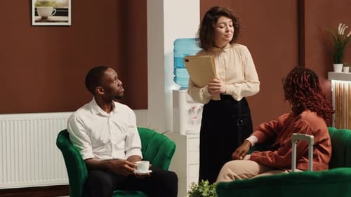 People Meeting in Modern Hotel Lobby
