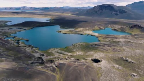 Aerial view of lakes and mountains in serene valley, Iceland.