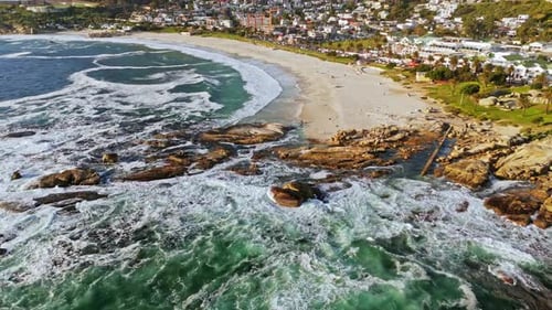 Imagine a drone gliding smoothly over the pristine shores of Camps Bay Beach.